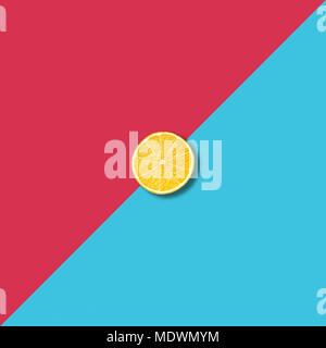 Minimalist abstract illustration with single lemon slice on vibrant red and turquoise background Stock Photo