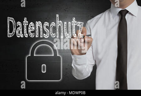 Datenschutz (in german Privacy Policy) is written by businessman on screen. Stock Photo
