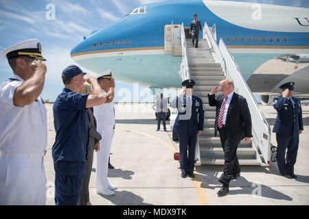 MIAMI, FL - WEEK OF APRIL 16: President Donald J. Trump waves as he disembarks Marine One at Joint Base Andrews, MD, Monday, April 16, 2018, escorted to Air Force One by Col. Casey Eaton, Commander 89th Airlift Wing, at Andrews Air Force Base. President Trump is flying to Miami International Airport to participate in a tax cuts for Florida small businesses roundtable at Bucky Dent Park, Monday, April 16, 2018, in Hialeah, FL   People:  President Donald Trump Stock Photo