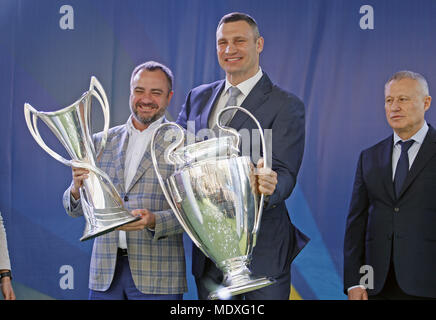 Kiev, Ukraine. 21st Apr, 2018. ANDRIY PAVLENKO (L), president of the Football Federation of Ukraine, and VITALI KLITSCHKO (R), mayor of Kiev, pose with the trophies during a handover ceremony in downtown Kiev, Ukraine, on 21 April 2018. Kiev will host the UEFA Champions League Final matches on 24 and 26 May 2018. Credit: Serg Glovny/ZUMA Wire/Alamy Live News Stock Photo