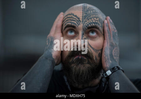 Frankfurt, Germany. 21st April, 2018.  Dimistay presents his inked skin at a tattoo convention where tattoo artists and enthusiasts travel from far and wide to exchange ideas, techniques and knowledge. Photo: Boris Roessler/dpa Credit: dpa picture alliance/Alamy Live News Stock Photo