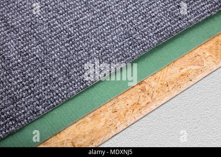 High Angle View Of A New Grey Carpet Corner Stock Photo