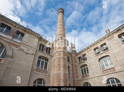 Paris, 101 avenue de la république, lycee Voltaire, former chimney of the boiler room Stock Photo