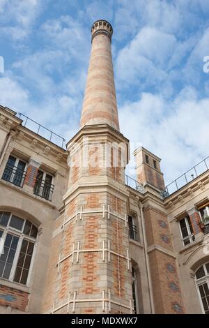 Paris, 101 avenue de la république, lycee Voltaire, former chimney of the boiler room Stock Photo
