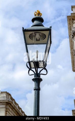 Old wrought iron lamp post with gold trim on top outside Somerset House, The Strand, London. Portrait. Close up. Stock Photo