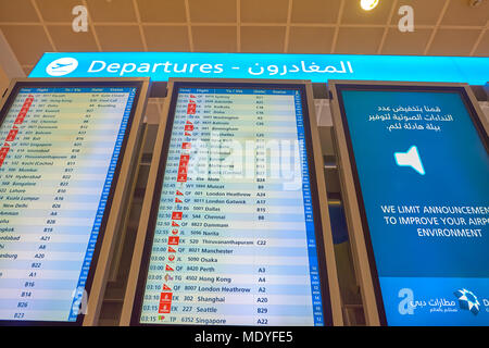 DUBAI, UAE - CIRCA NOVEMBER, 2015: flight schedule display at Dubai International Airport. It is the world's busiest airport by international passenge Stock Photo