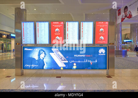 DUBAI, UAE - CIRCA NOVEMBER, 2015: flight schedule display at Dubai International Airport. It is the world's busiest airport by international passenge Stock Photo