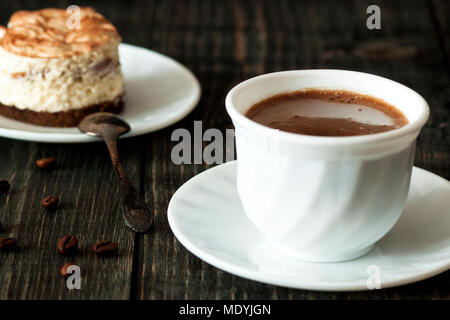 a cup of coffee and tiramisu Stock Photo