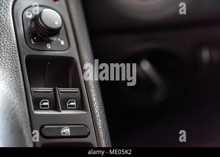 Window lifter and mirror adjustment buttons in car Stock Photo