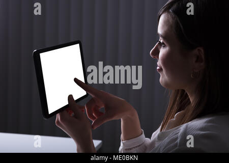 Woman Using Digital Tablet With Blank White Screen Stock Photo