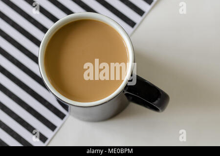 Coffee cup top view, black and white striped background, black cup, Stock Photo