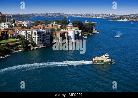 Ferry boat leaving shore in Sydney Harbour on a sunny day in Sydney, Australia Stock Photo