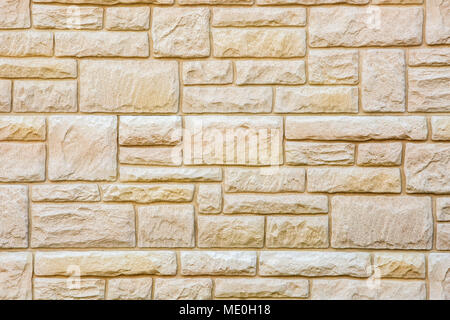 Background of natural brown stone tiles, marble brick wall Stock Photo