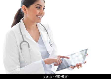Female doctor using digital tablet. Stock Photo