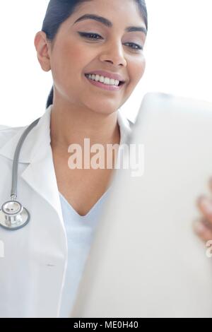 Female doctor using digital tablet. Stock Photo
