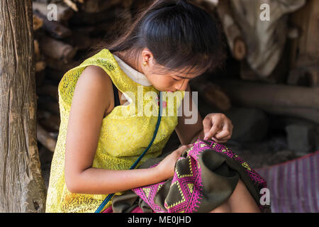 Hmong woman making embroideries, Na Aouan Village; Luang Prabang, Laos Stock Photo