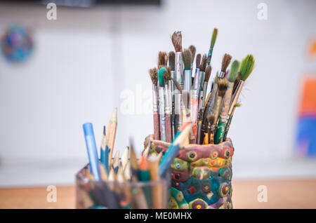 Painting Studio tools. Set of artistic brushes in basket Stock Photo