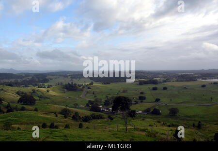 Broad panorama of the countryside in North New South Wales with green fields. Grassy hills in Australia. View from Minyon Falls lookout, Nightcap Nati Stock Photo