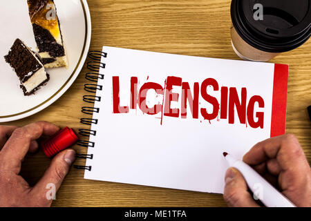 Conceptual hand writing showing Licensing. Business photo showcasing Grant a license Legally permit the use of something Allow activity written by Man Stock Photo