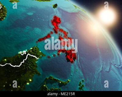 Sunrise above Philippines highlighted in red on model of planet Earth ...