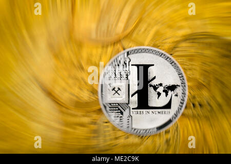 Symbol image turbulence Share price digital currency, gold physical coin Litecoin Stock Photo