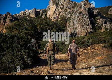 Spanish Marine Col. Juan M. Báez, deputy commander of Trecio de Armada (right), and U.S. Marine Col. Michael J. Perez, the commanding officer of Special Purpose Marine Air-Ground Task Force-Crisis Response-Africa (left), tour Sierra del Retin, Spain, Dec. 20, 2017. SPMAGTF-CR-AF is deployed to conduct limited crisis-response and theater-security operations in Europe and North Africa. (U.S. Marine Corps photo by Sgt. Takoune H. Norasingh/Released) Stock Photo