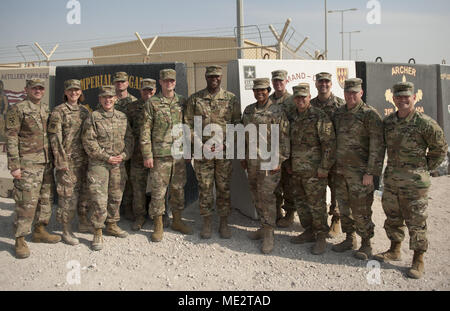 Majors throughout the Top Notch 11th Air Defense Artillery “Imperial” Brigade pose for a photo outside the brigade headquarters building during the Majors Forum held at Al Udeid Air Base, Qatar, Dec. 29, 2017. The Majors Forum was designed to build cohesion, build relationships and provide professional development to the field grade officers. (U.S. Army photo by Staff Sgt. Johnathan Hoover) Stock Photo