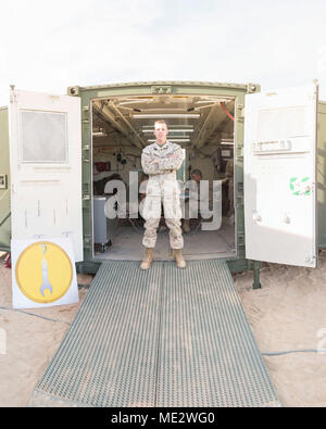 U.S. Marine Corps Expeditionary Manufacturing field exercise at Marine Corps Air Ground Combat Center Twentynine Palms on Dec. 9, 2017 involved a machinist assigned to Ordnance Maintenance Company, 1st Maintenance Battalion, Combat Logistics Regiment 15, 1st Marine Logistics Group, working inside an Expeditionary Manufacturing shelter during Exercise Steel Knight 18. The archival image documents development of a Marine Corps 3D printing capability in a field environment. Stock Photo