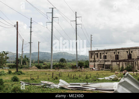 United States Army Corps of Engineers is a federal engineering agency providing disaster response and infrastructure repair. The archival image documents contractors installing wood and aluminum utility poles in Mayaguez, Puerto Rico, Dec. 8, 2017, during FEMA-assigned efforts to restore the hurricane-damaged electrical network with support from the Government of Puerto Rico. Stock Photo