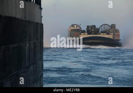 180416-N-GR168-0240 MEDITERRANEAN SEA (April 16, 2018) Landing Craft, Air Cushion 83, attached to Assault Craft Unit 4,  enters the well deck of the San Antonio-class amphibious transport dock ship USS New York (LPD 21) April 16, 2018. New York, homeported in Mayport, Flaorida, is conducting naval operations in the U.S. 6th Fleet area of operations. (U.S. Navy photo by Mass Communication Specialist 2nd Class Lyle Wilkie/Released) Stock Photo