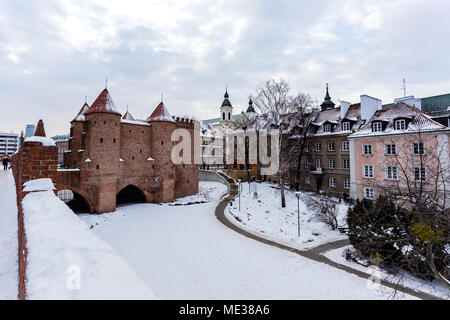 Warsaw Barbacan fortress castle in winter is in the capital city of Poland. Old town is the historic center of Warsaw. architecture concept. Stock Photo