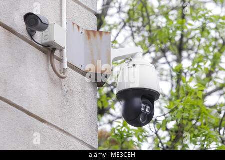 Surveillance cameras on the exterior wall of a building Stock Photo