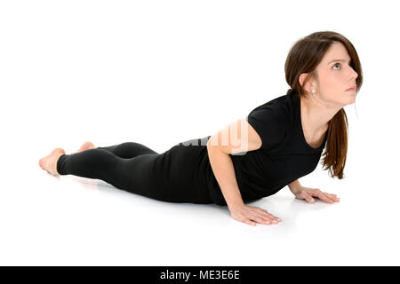 young woman doing yoga asana Bhujangasana Cobra Pose Stock Photo