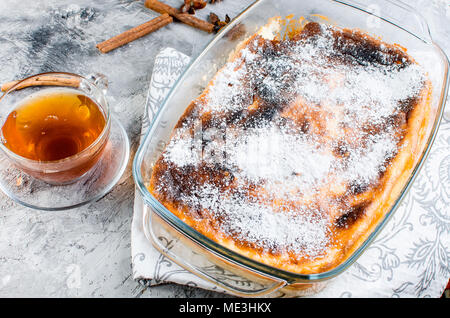 cottage cheese casserole with  tea on a wooden table. health or diet concept.selective focus Stock Photo