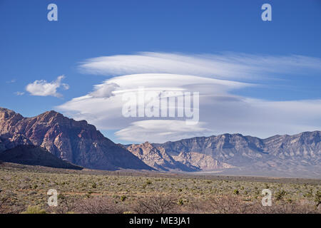 lenticular clouds forming over the mountains north and west of Las Vegas Stock Photo