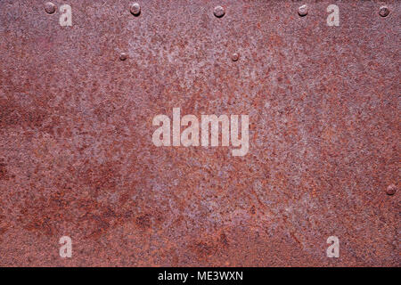 rusty metal background with a few rivets Stock Photo