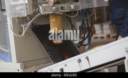 Food manufacturing - packing of macaroni in plastic bags Stock Photo