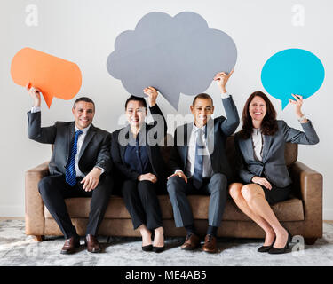 Business people sitting together with icons Stock Photo