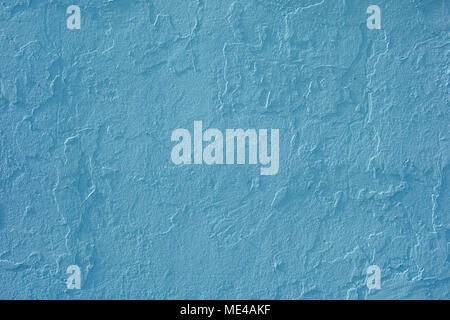 A blue painted outside wall in the summer light. Stock Photo