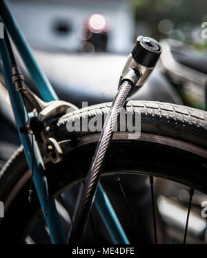 Metal lock on a bicycle wheel Stock Photo