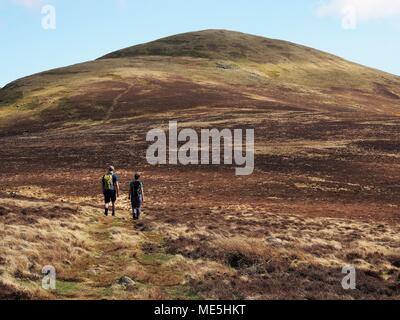 Two Walkers heading towards Starling Dodd, Lake District National Park, Cumbria, United Kingdom Stock Photo