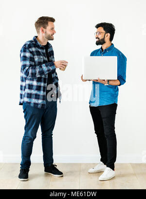 Diverse colleague men talking together Stock Photo