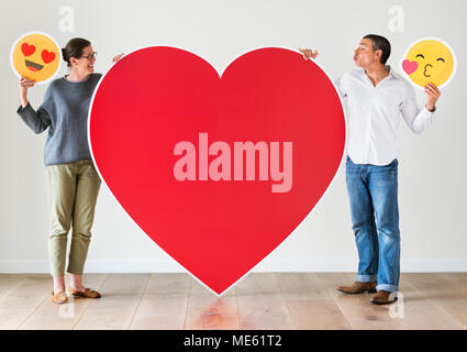 Couple holding red heart mockup Stock Photo