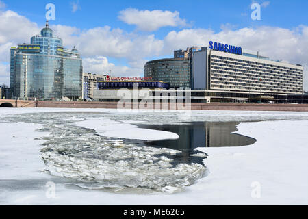 St Petersburg, Russia - March 27, 2018. View of Pirogovskaya embankment of Bolshaya Nevka river in St Petersburg, with commercial and residential buil Stock Photo