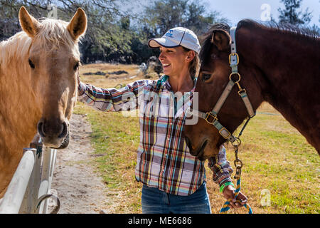 Katcha with LUSITANO horses at the Granja Las Animas Ranch - San MIguel de Allende Mexico Stock Photo