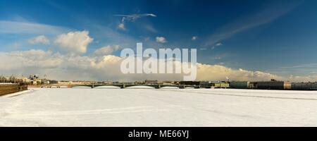 St Petersburg, Russia - March 27, 2018. Panoramic view toward Troitskiy bridge in St Petersburg, with frozen Neva river, architectural residential and Stock Photo