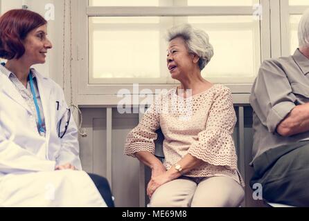 An elderly patient meeting doctor at the hospital Stock Photo