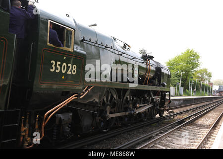 London, UK. 21st April, 2018. British Railways Merchant Navy Class 35028 Clan Line steam locomotive, Whitton Station, London UK, 21 April 2018, Photo by Richard Goldschmidt, 35028 Clan Line is a main line coal-fired steam locomotive built at the Eastleigh Works in 1948. While working the Atlantic Coast Express in 1961, it was unofficially timed at 104 mph passing Axminster. On 2 July 1967, Clan Line hauled a 'farewell special' from Waterloo to Bournemouth and back ending its British Railways career. Credit: Rich Gold/Alamy Live News Stock Photo