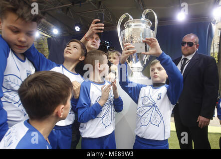 Kiev, Ukraine. 21st Apr, 2018. Ukrainians take photos of the UEFA Champions League trophy during a handover ceremony in downtown Kiev, Ukraine, on 21 April 2018. Kiev will host the UEFA Champions League Final matches on 24 and 26 May 2018. Credit: Serg Glovny/ZUMA Wire/Alamy Live News Stock Photo