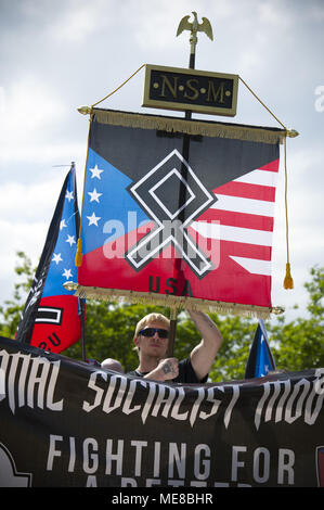 Newnan, Georgia, USA. 21st Apr, 2018. An estimated 35 Neo Nazi white supremacists gather to rally in park in this small Georgia town, surround by by hundreds of law enforcement personnel and hundreds of anti-white supremacist protesters Credit: Robin Rayne Nelson/ZUMA Wire/Alamy Live News Stock Photo